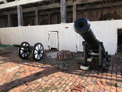 04B A small and a huge cannon on the inside of Fort Charles Port Royal Kingston Jamaica